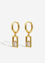 Regal Aura Drop Earrings are a pair of earrings with a square stone.