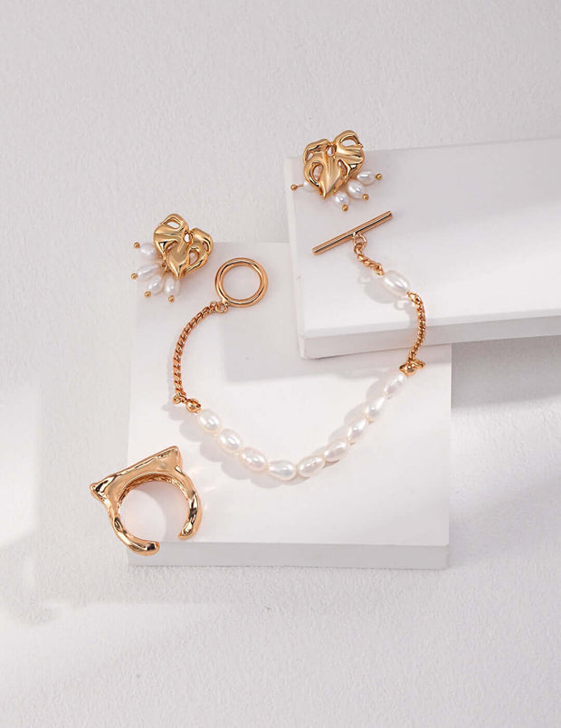 A pair of Chloe's Pearl Bracelet earrings and a pair of Chloe's Pearl Bracelet rings with 18K Gold Plated on 925 Sterling Silver