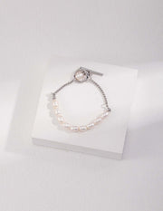 A Chloe's Pearl Bracelet on a white surface.