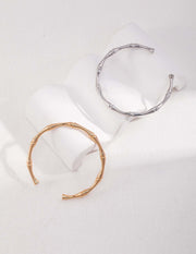 A stylish pair of Bamboo Bangle cuff bracelets.